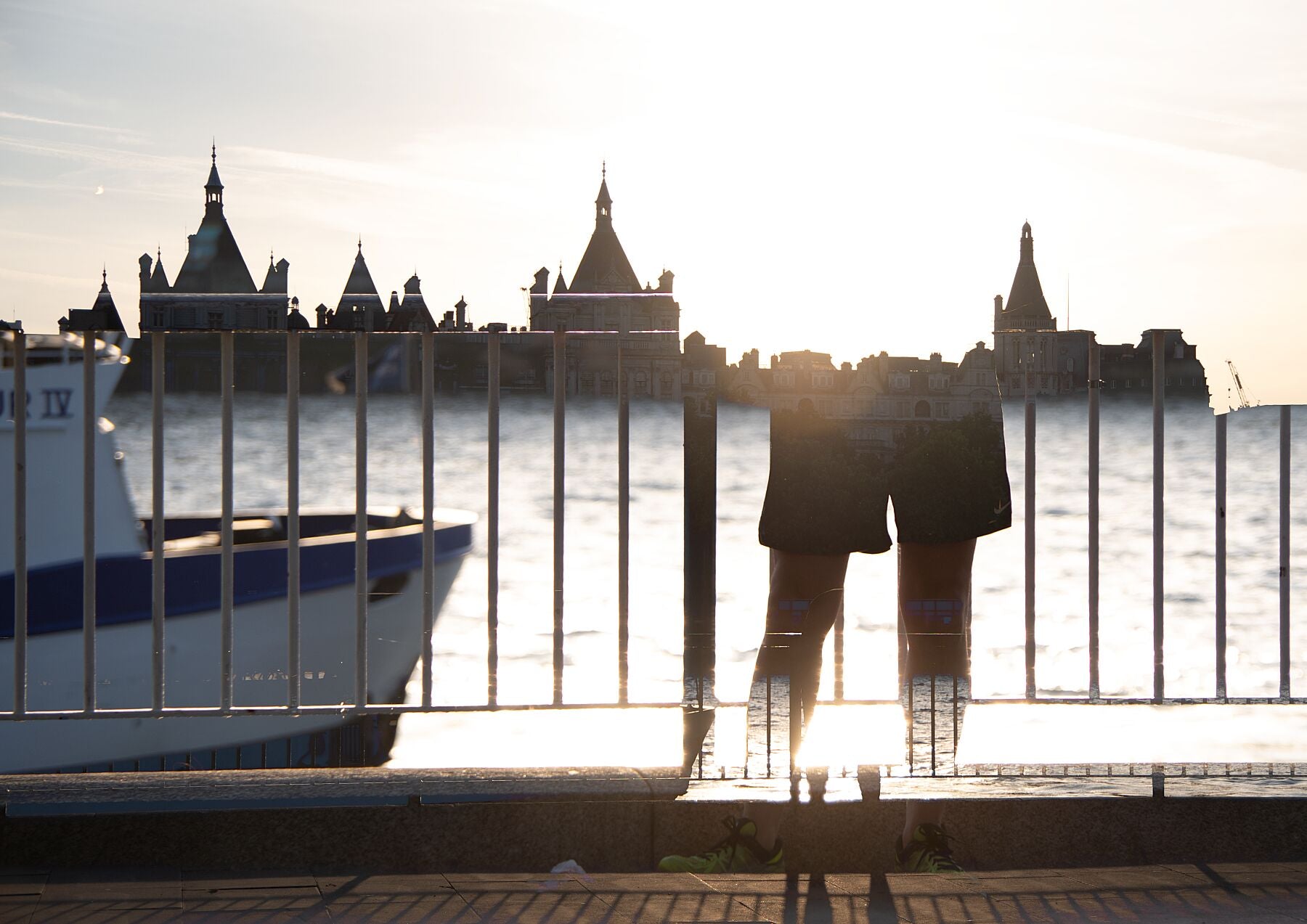 The Edge of Night - a man standing by the River Thames in London